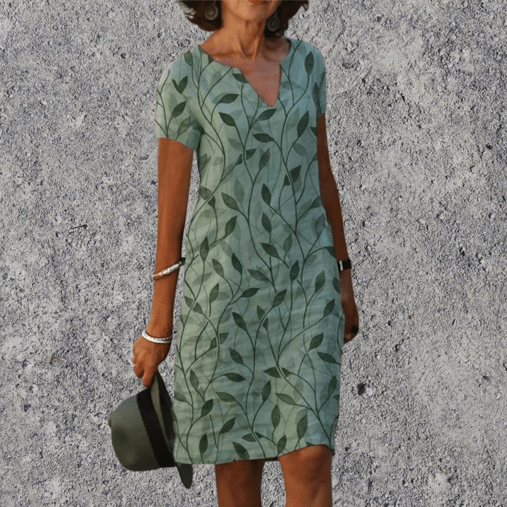 Back view of the breathable short sleeve summer midi dress with floral botanical print