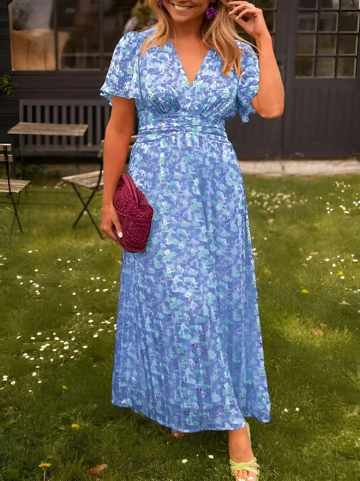 Detailed shot of V-neckline and sleeveless bodice on womens fashion floral maxi dress