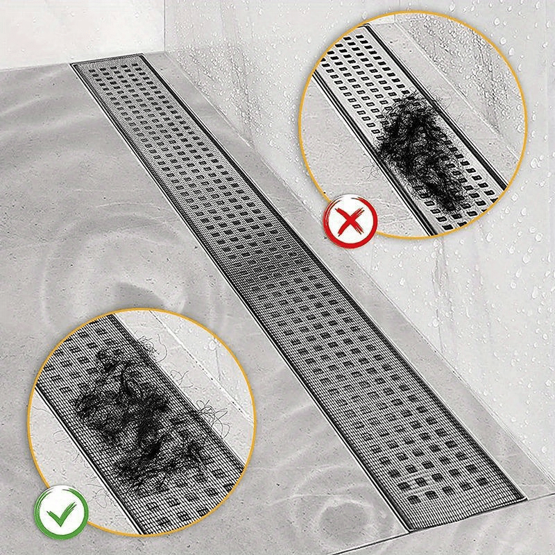 Drain protection mesh installed over a long shower floor drain catching debris