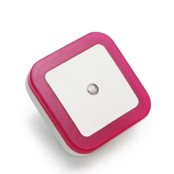 Children's LED night light plugged into a hallway wall for safety