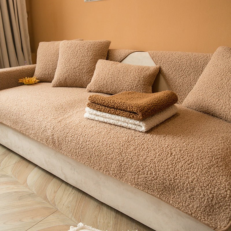 Folded plush couch protector in neutral color ideal for home decor and easy machine washing