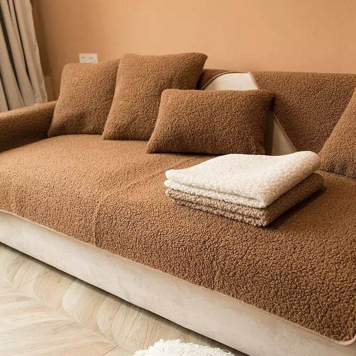 Angled view of plush couch protector emphasizing pet-friendly material and non-slip features