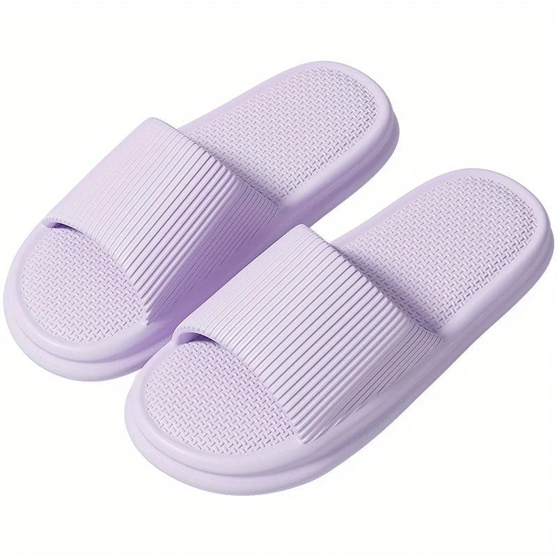 Pair of purple textured comfort slippers
