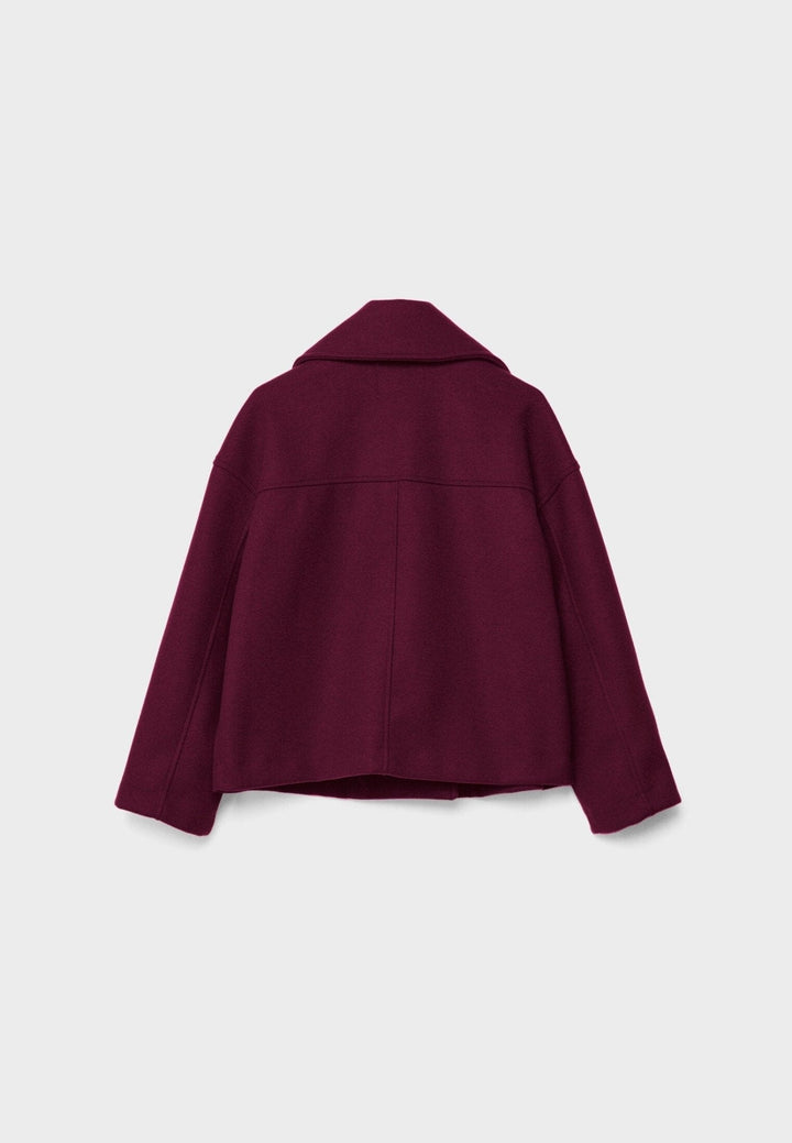 Double breasted womens coat designed with a flattering cropped cut