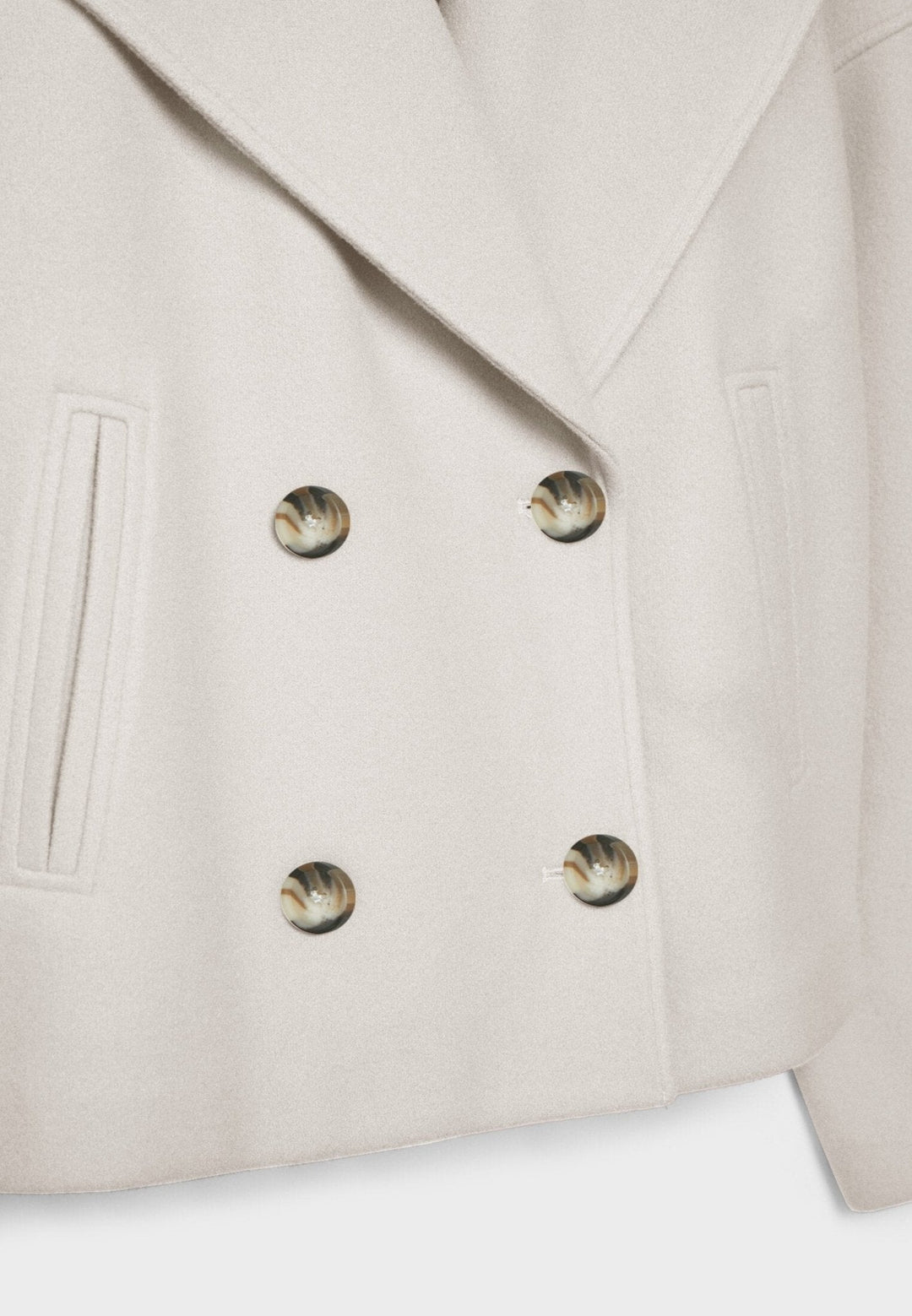 Elegant lapel collar detail on a warm womens winter outerwear item