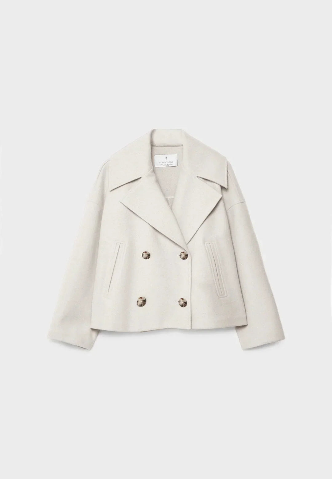 White cropped double breasted jacket flat lay view