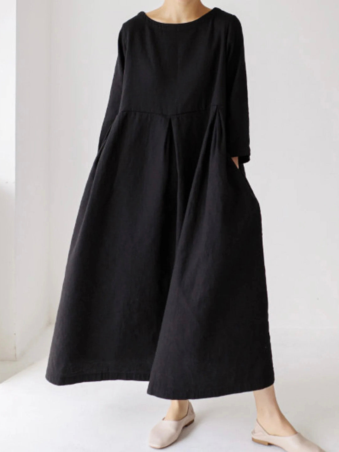 Woman wearing classic black long maxi dress