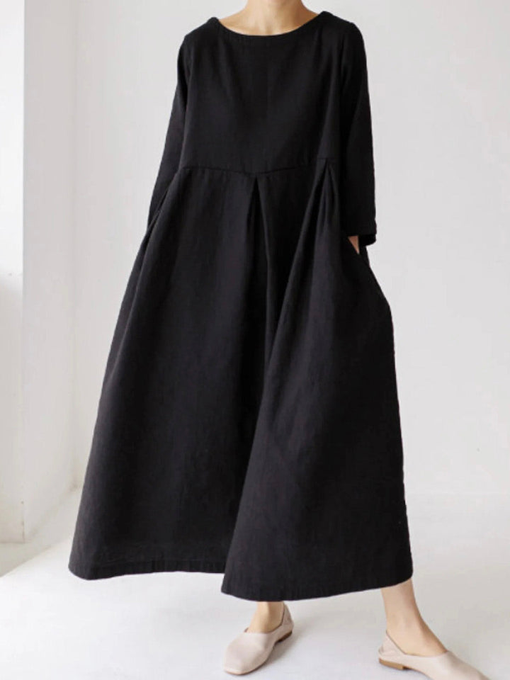 Woman wearing classic black long maxi dress
