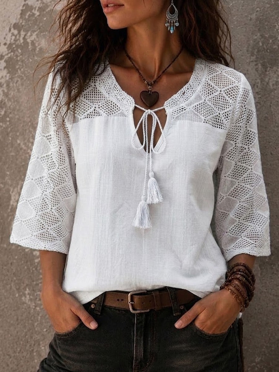 Model wearing white boho crochet trim V-neck tunic top from the front