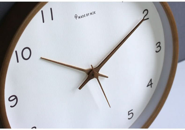 Modern wooden clock face showing clear hour markers
