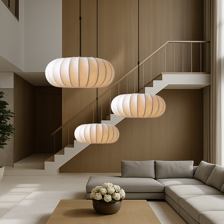 Modern silk pendant lamp casting warm LED ambient light in minimalist dining room