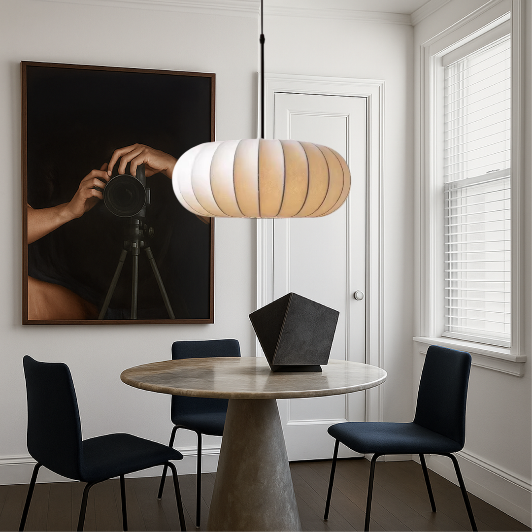 Minimalist silk pendant lamp illuminating cozy living space with warm LED glow