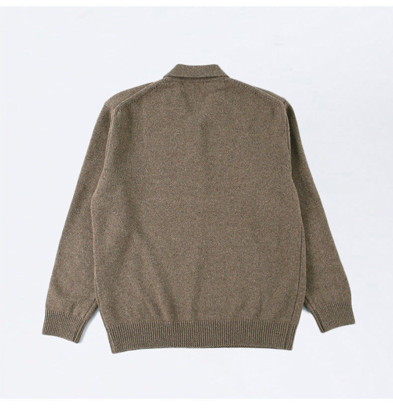 Flat lay of mens button polo sweater styled for smart casual menswear