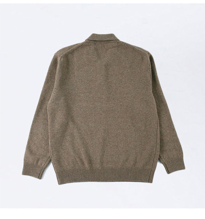 Flat lay of mens button polo sweater styled for smart casual menswear