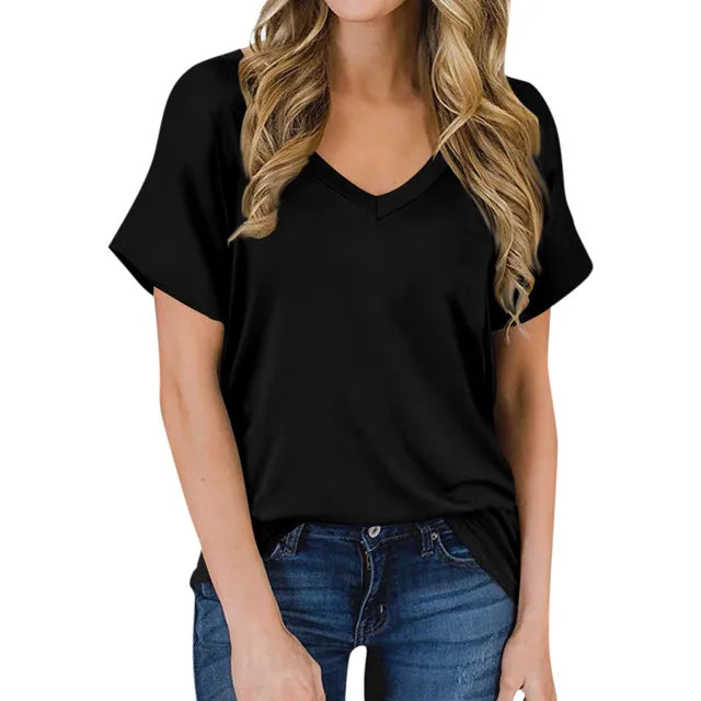 Woman wearing a black simple V-neck short sleeve t-shirt with blue jeans