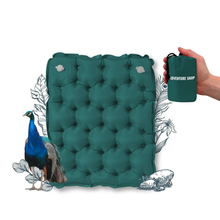 Person sitting comfortably on ultralight hiking accessories cushion outdoors