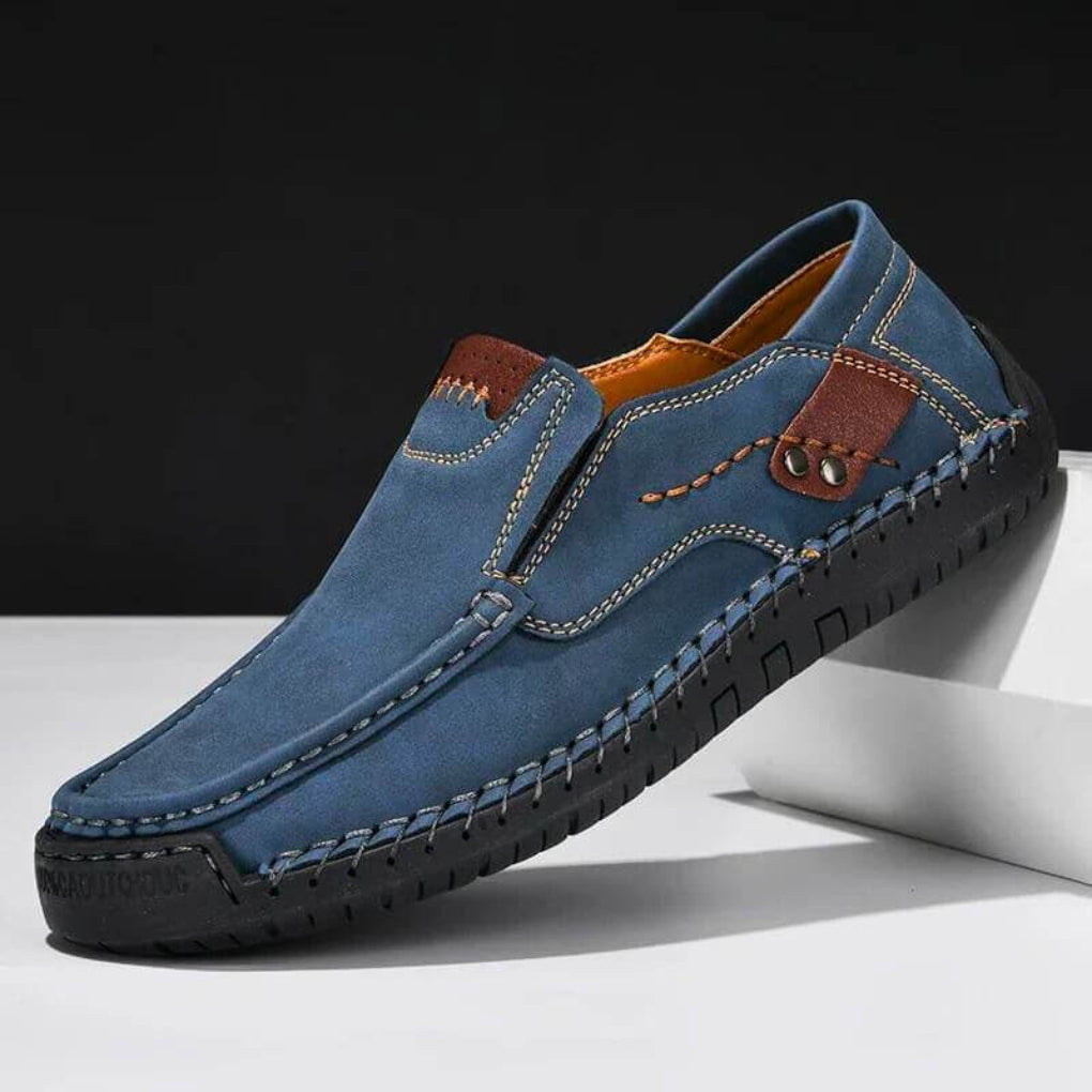 Blue men's casual slip-on shoe with contrast stitching and arch support