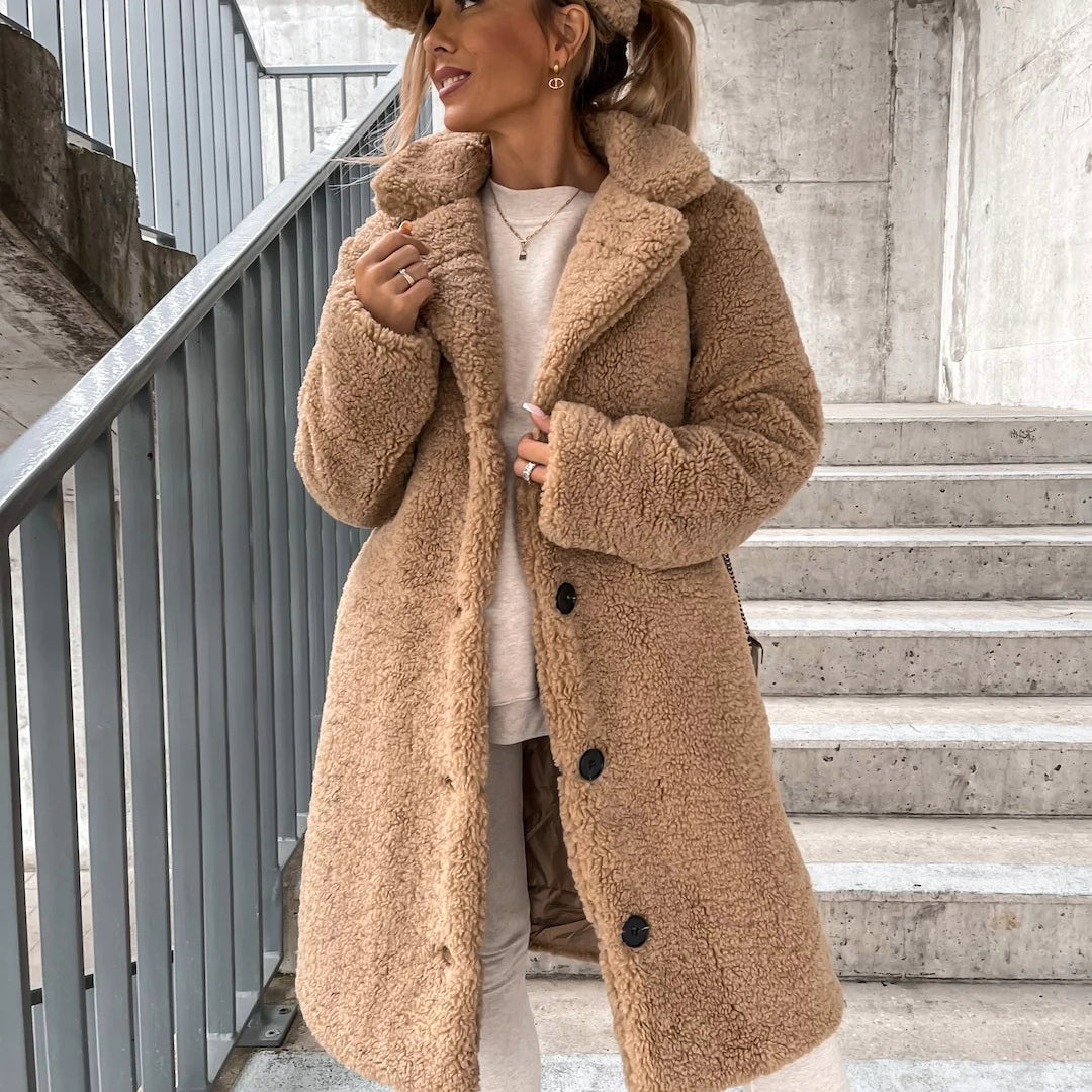 Woman wearing beige oversized teddy long coat outdoors