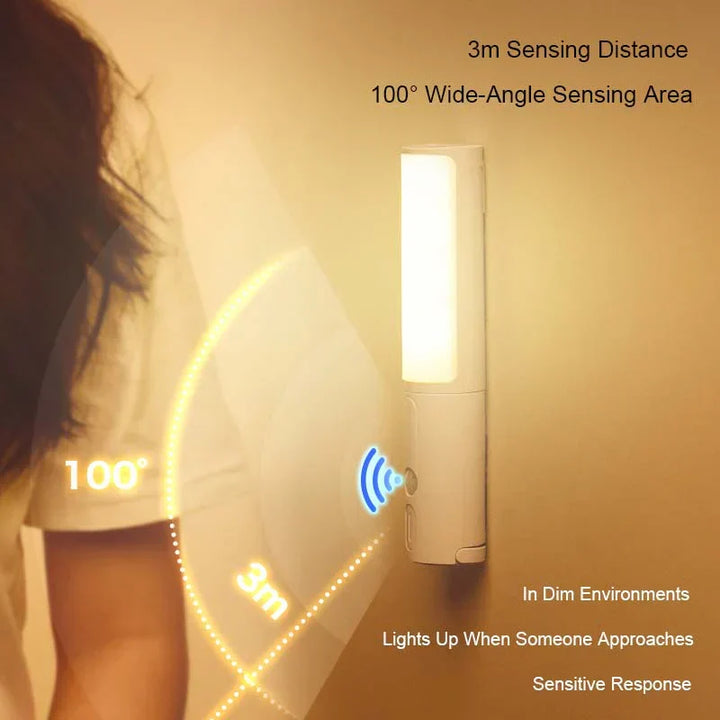 Rechargeable wireless LED night light glowing softly on a bedroom wall