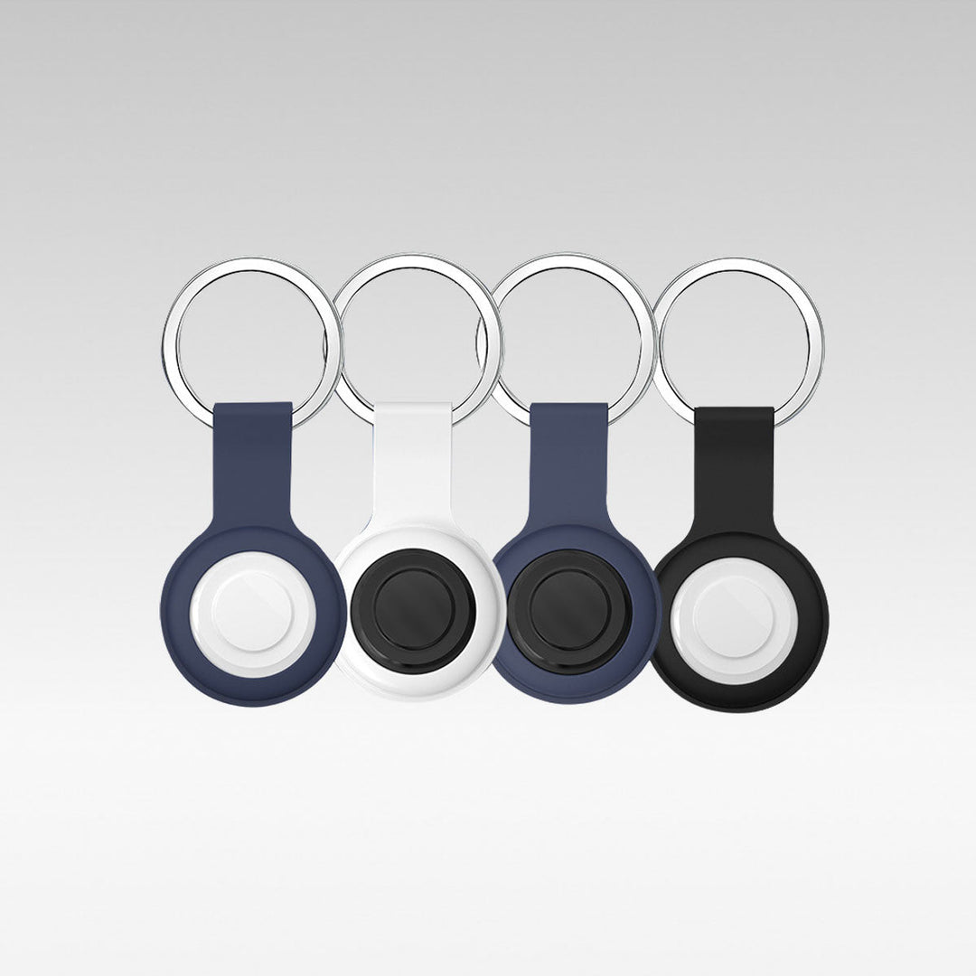 Four colored smart pet GPS tracker holders with keyrings