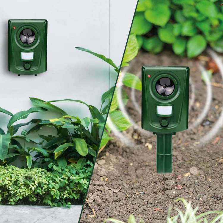 Animal deterrent pest control device mounted in a green lawn for outdoor use