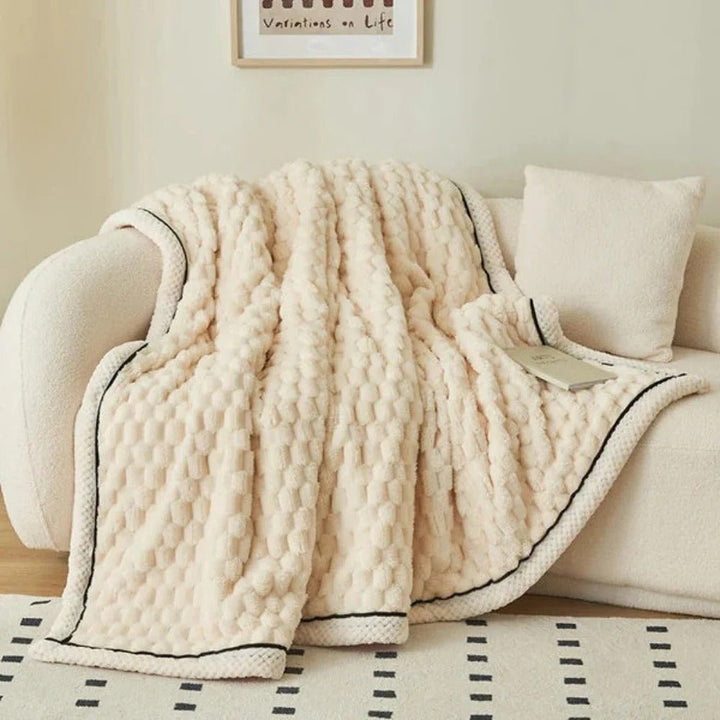 Cozy throw blanket styled casually for everyday living room use