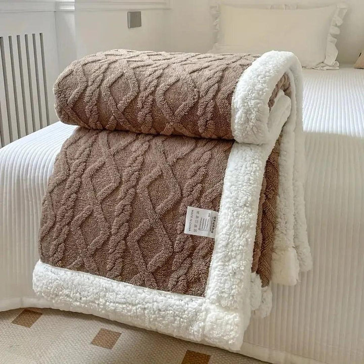Cozy fleece blanket folded neatly, perfect for home decor and bedding