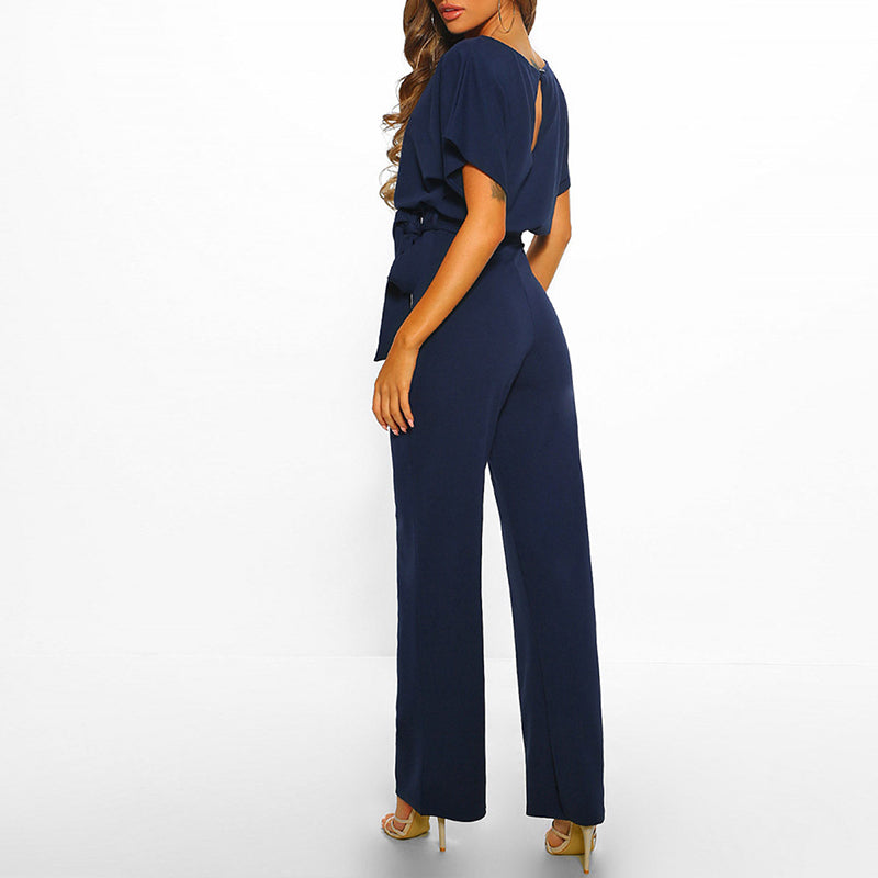 Sophisticated one-piece formal wear featuring a stylish waist belt