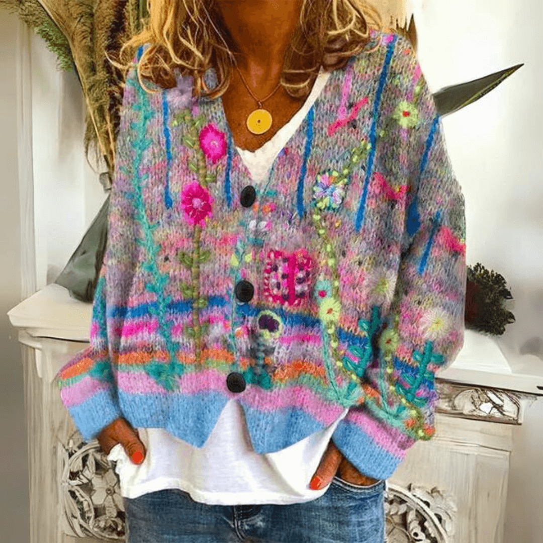 Woman wearing blue floral embroidered soft knit cardigan with button closure