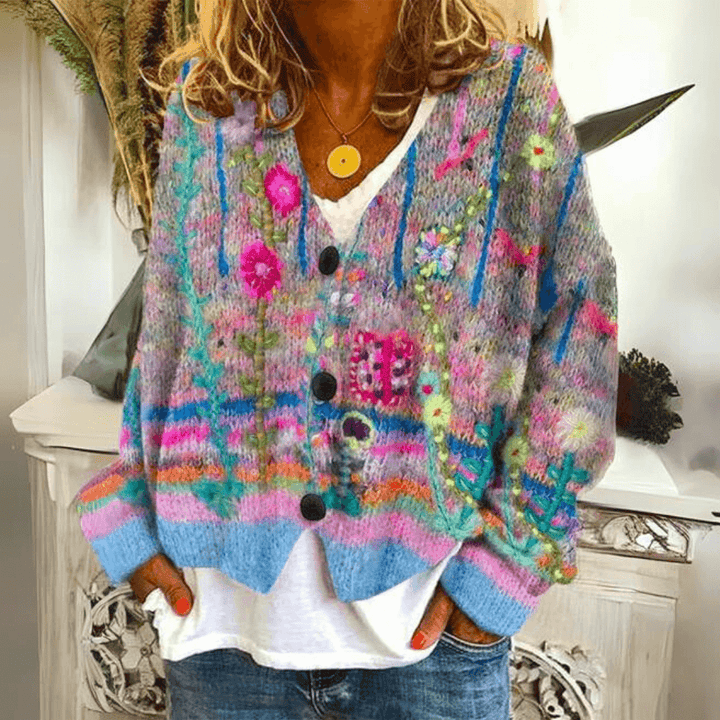 Woman wearing blue floral embroidered soft knit cardigan with button closure
