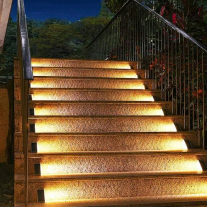 Waterproof solar stair lights installed on outdoor wooden steps for pathway safety