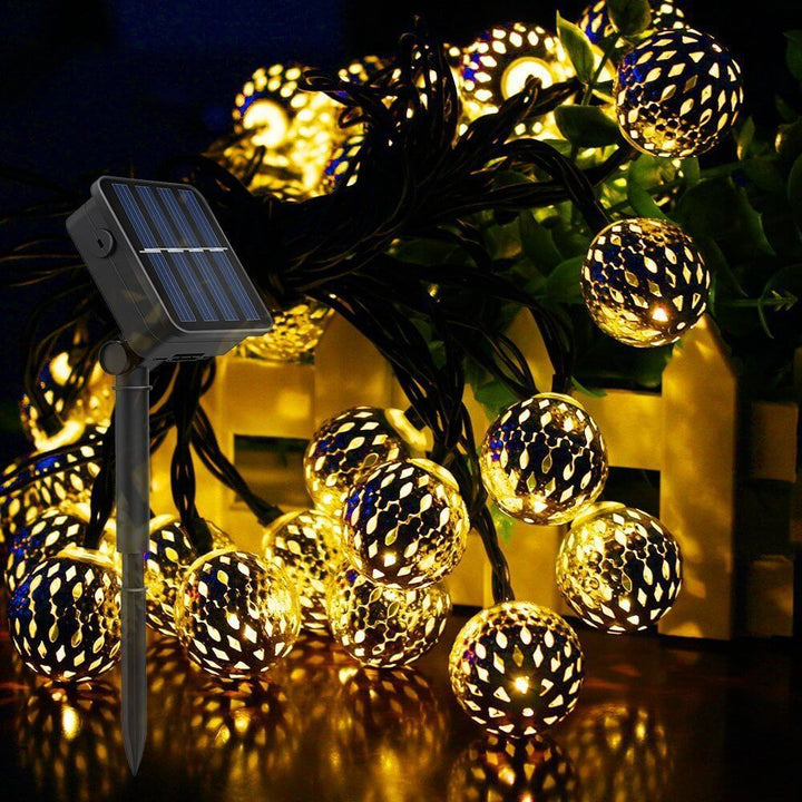 Solar panel and stake setup for outdoor Moroccan garden garland