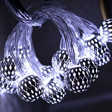 Hanging led string lights creating warm patio ambiance outdoors