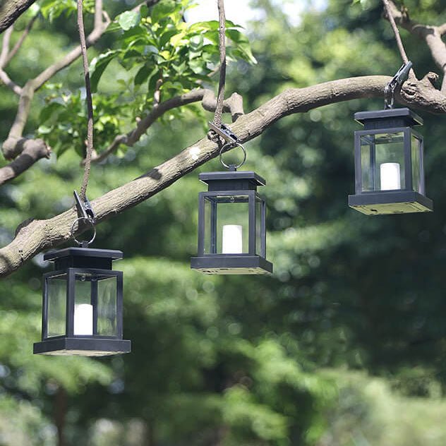 Solar hanging lanterns displayed in daylight hanging outdoors