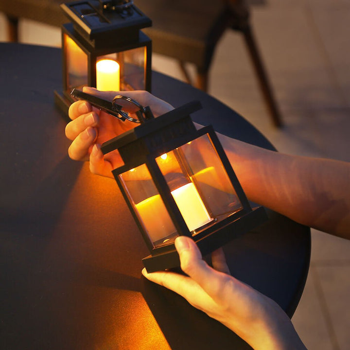 Eco friendly solar lantern illuminated in a dark setting for patio lighting