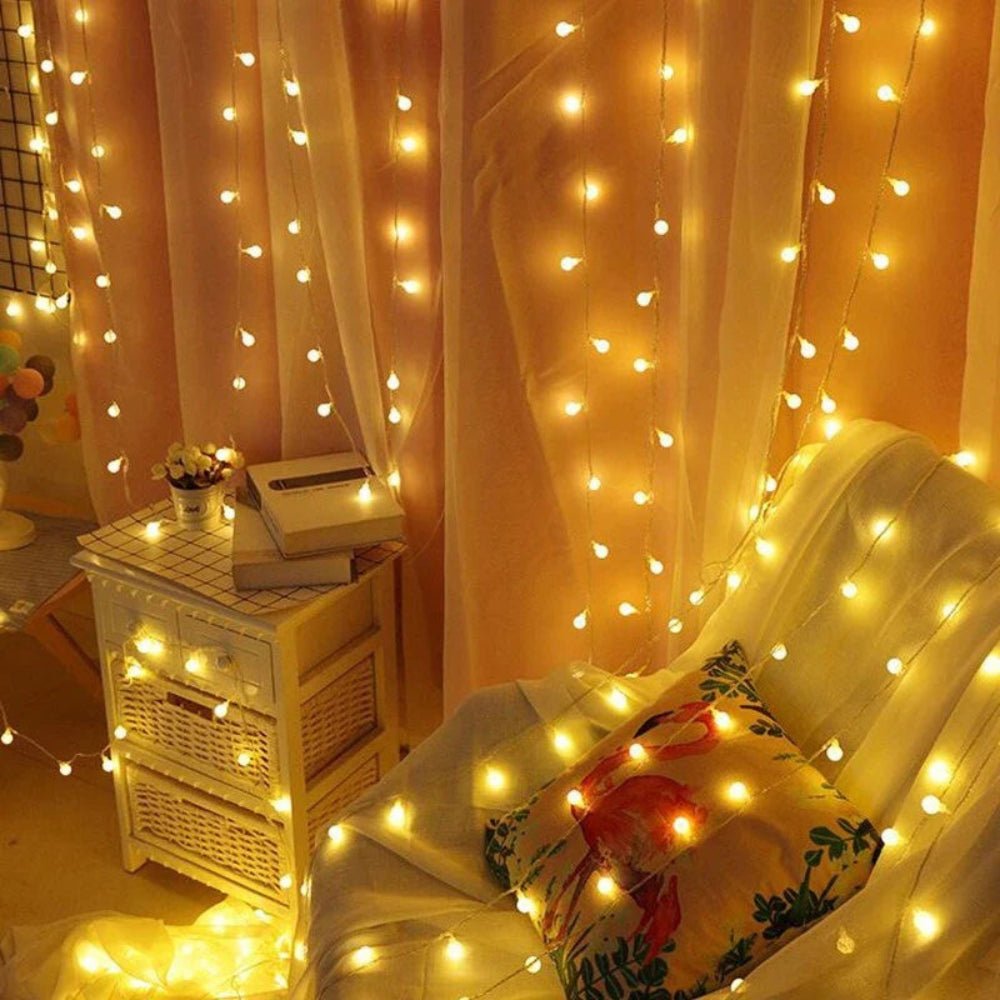 Waterproof solar fairy lights illuminating backyard trees at night