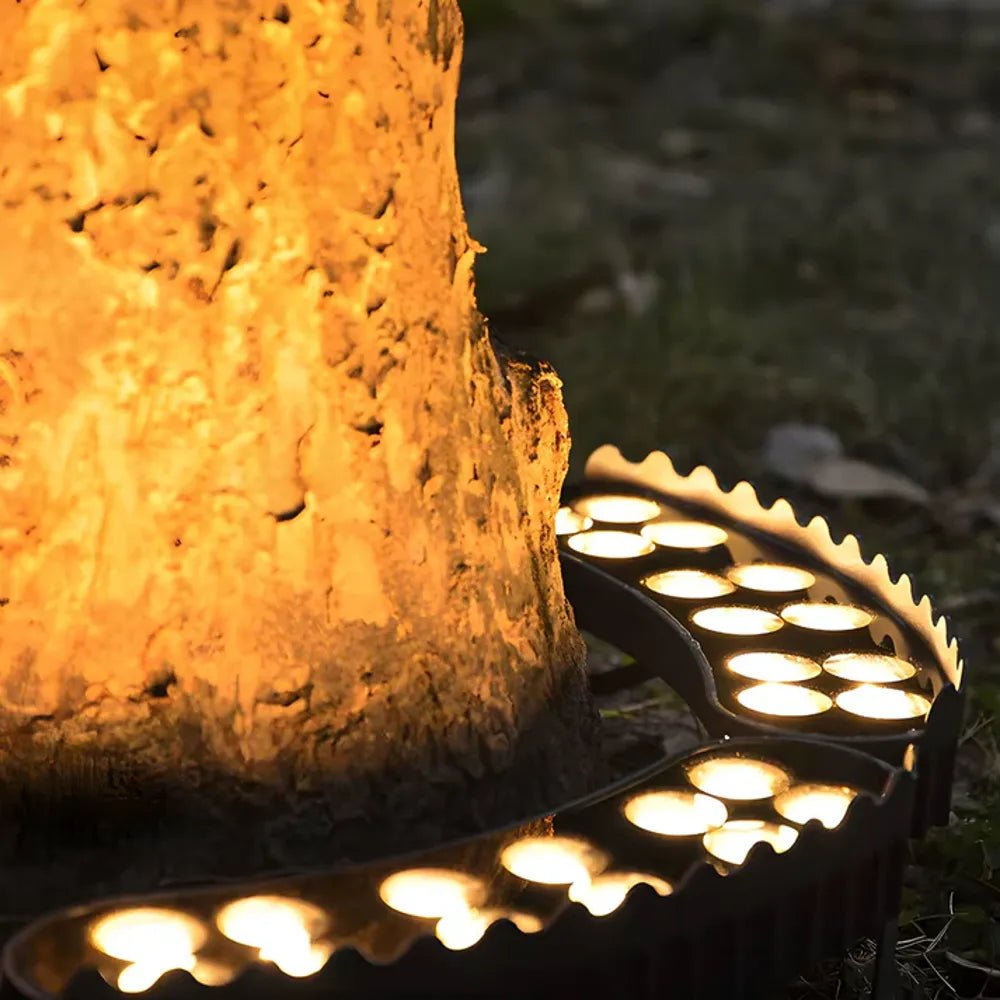 Waterproof outdoor solar garden light casting warm glow on tree trunk