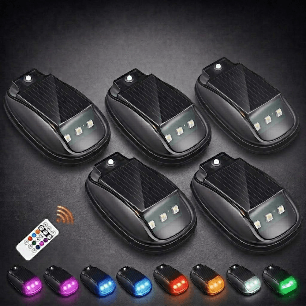 Adhesive mount solar off-road lights attached securely to a vehicle chassis