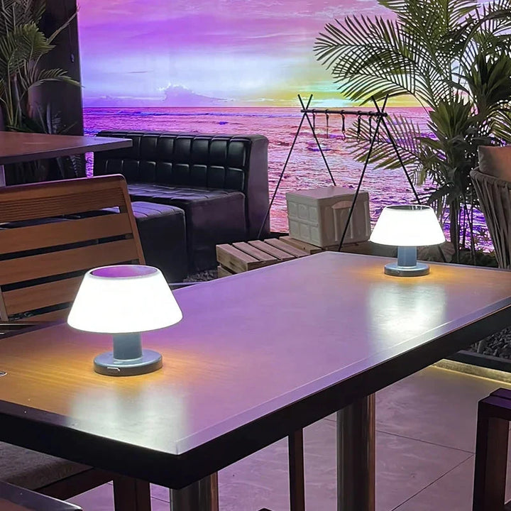 Eco-friendly solar table lamp lighting an outdoor patio table setup