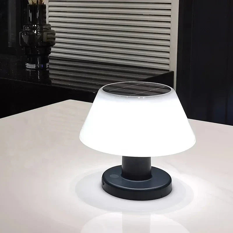 Versatile LED table lamp used as stylish garden decor during a warm summer evening.