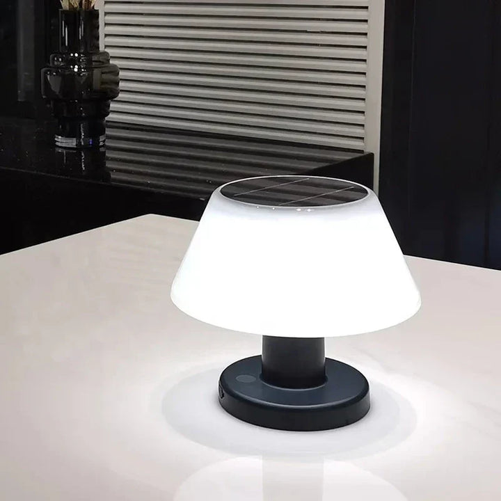 Versatile LED table lamp used as stylish garden decor during a warm summer evening.