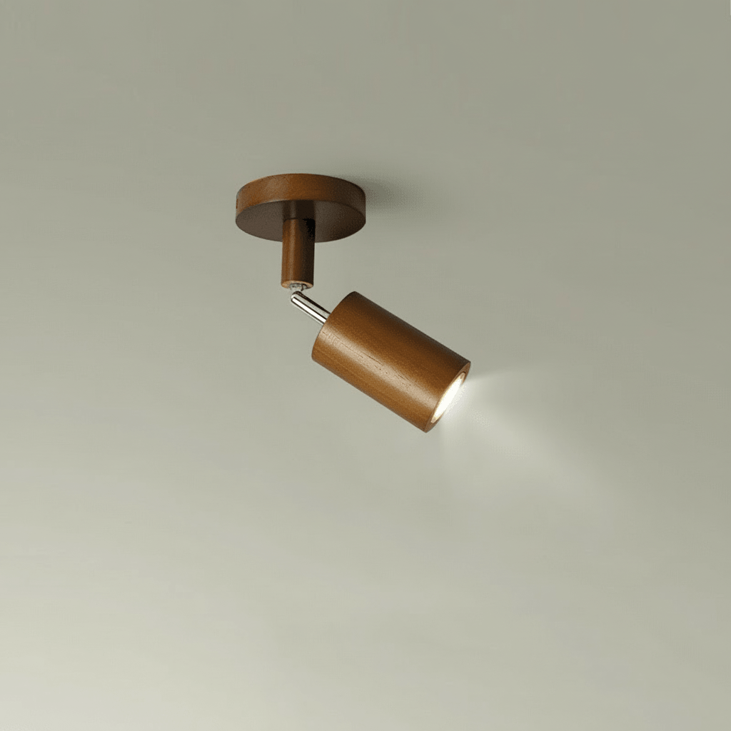 Single head solid wood LED ceiling spotlight glowing against a neutral wall