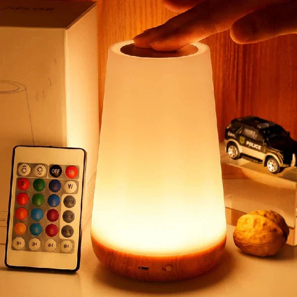 Touch bedside night light showing top sensor and remote control