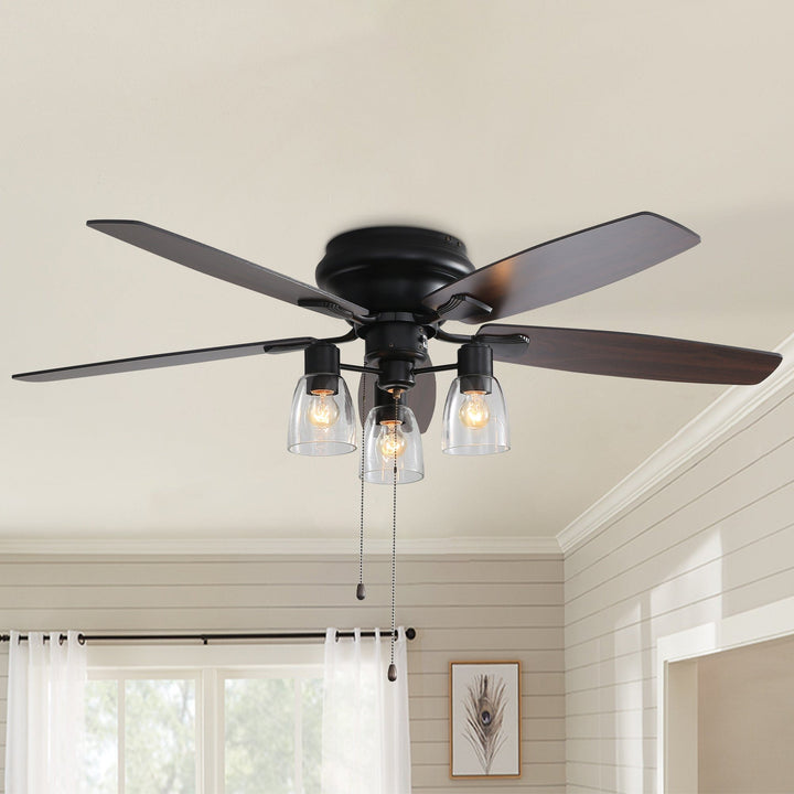 Modern 52-inch low profile ceiling fan with LED light installed in a living room