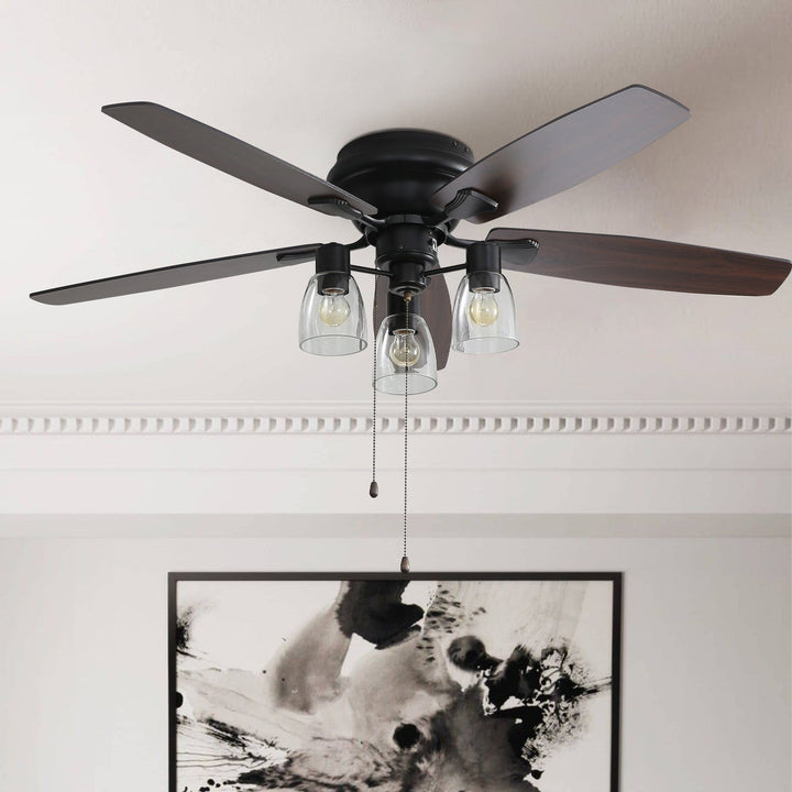 Close-up view of the black flush mount ceiling fan with glass light shades