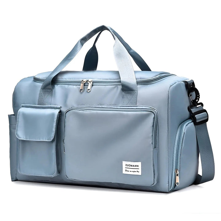 Unisex travel bag featuring heavy duty zippers and reinforced handles