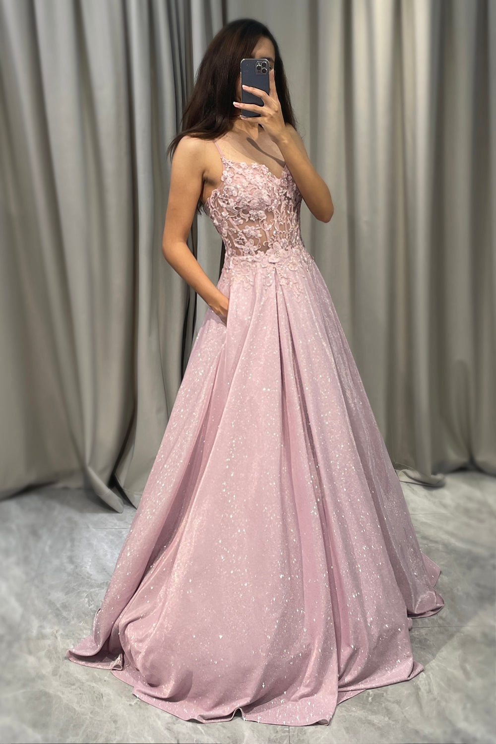 Blush pink A-line formal ball gown back view with spaghetti straps