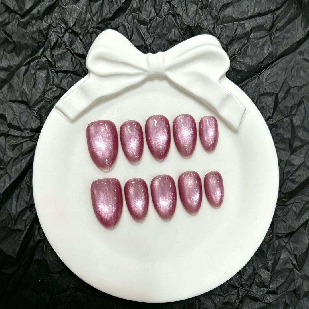 Close-up of the sparkling pink artificial nail set showcasing the polished finish