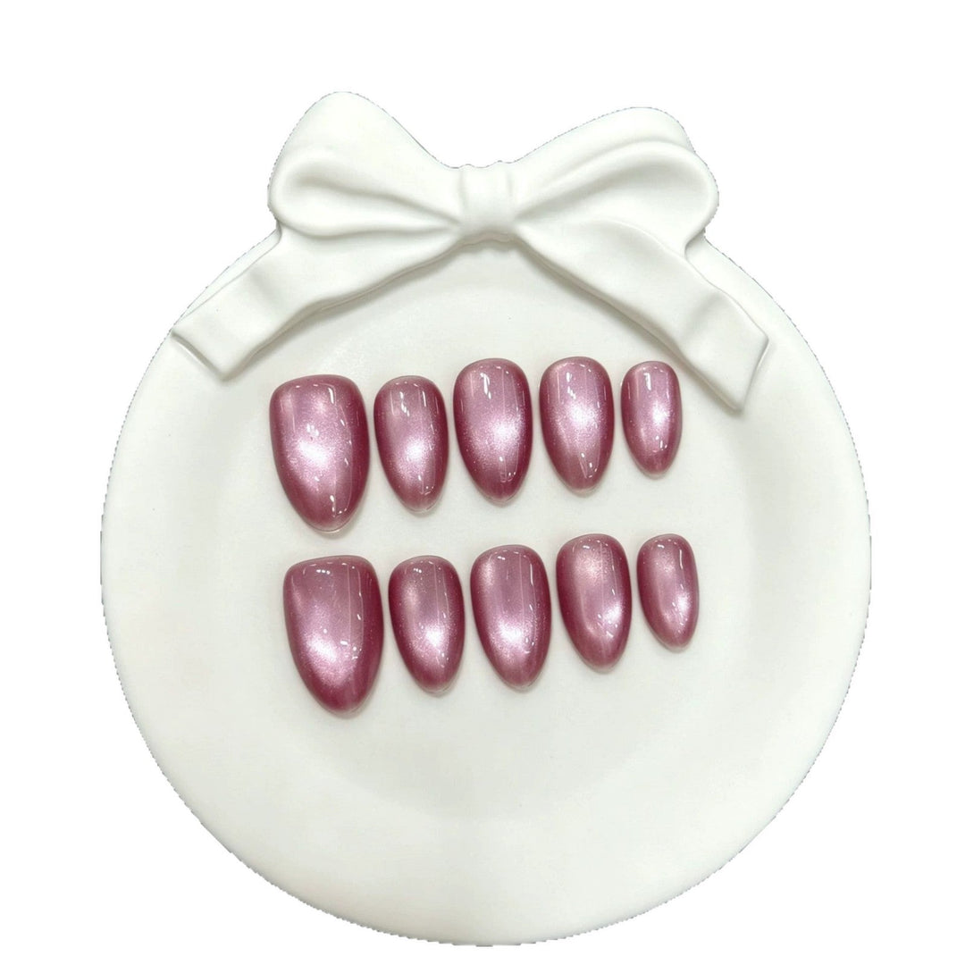 Close-up view of shimmering pink artificial false nails for beauty accessories