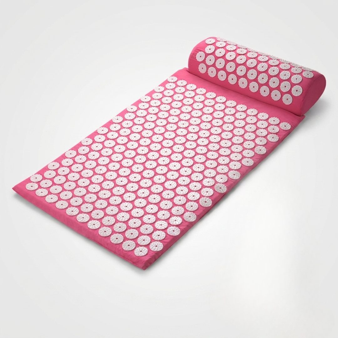 Close-up of plastic stimulation spikes on blue wellness acupressure massage mat for stress relief